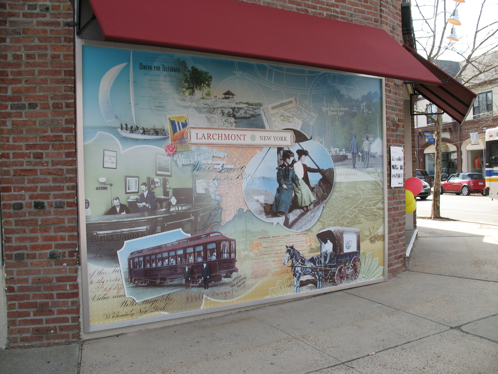 a large exterior graphic print celebrating the history of Larchmont, NY
